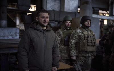 In this photo provided by the Ukrainian Presidential Press Office, Ukrainian President Volodymyr Zelensky (L) speaks to soldiers at the site of the heaviest battles with the Russian invaders in Bakhmut, Ukraine, December 20, 2022. (Ukrainian Presidential Press Office via AP) In this photo provided by the Ukrainian Presidential Press Office, Ukrainian President Volodymyr Zelensky (L) speaks to soldiers at the site of the heaviest battles with the Russian invaders in Bakhmut, Ukraine, December 20, 2022. (Ukrainian Presidential Press Office via AP)