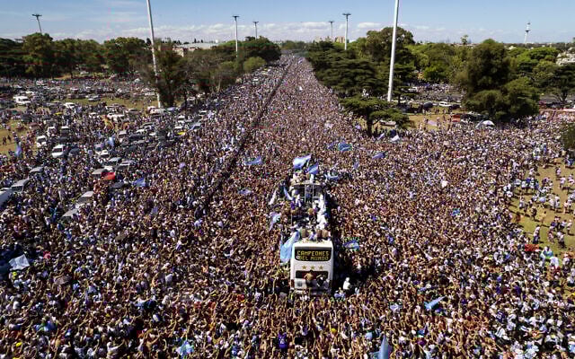 The Argentine soccer team that won the World Cup title ride on an open bus during their homecoming parade in Buenos Aires, Argentina, December 20, 2022. (AP Photo/Rodrigo Abd) The Argentine soccer team that won the World Cup title ride on an open bus during their homecoming parade in Buenos Aires, Argentina, December 20, 2022. (AP Photo/Rodrigo Abd)