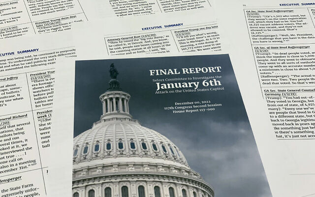 A photo of the final report released by the House select committee investigating the January 6, 2020 storming of the US Capitol, December 22, 2022. (AP/Jon Elswick)