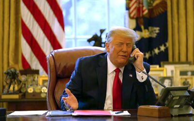 In this file image released in the final report by the House select committee investigating the January 6 attack on the US Capitol, on Thursday, December 22, 2022, former US president Donald Trump talks on the phone to former US vice president Mike Pence from the Oval Office of the White House on January 6, 2021. (House Select Committee via AP)