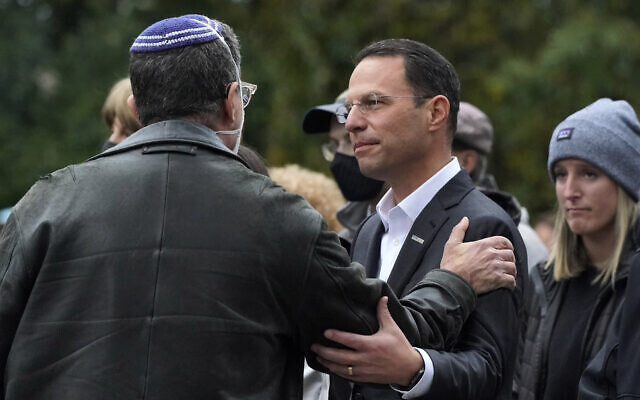Then-Pennsylvania attorney general Josh Shapiro, center, attends a Commemoration Ceremony in Schenley Park, in Pittsburgh's Squirrel Hill neighborhood, on October 27, 2021, three years after a gunman killed 11 worshipers at the Tree of Life Synagogue. (Gene J. Puskar/AP)