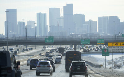 The skyline of downtown is shrouded after a winter storm swept over the country packing snow combined with Arctic cold, which created chaos for people trying to reach their destinations before the Christmas holiday, December 23, 2022, in Denver. (AP Photo/David Zalubowski)