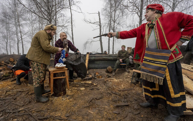 A group of artists perform for Ukraine's National Guard soldiers to mark Christmas at their positions close to the Russian border near Kharkiv, Ukraine Dec. 24, 2022. (AP Photo/Andrii Marienko) A group of artists perform for Ukraine's National Guard soldiers to mark Christmas at their positions close to the Russian border near Kharkiv, Ukraine Dec. 24, 2022. (AP Photo/Andrii Marienko)