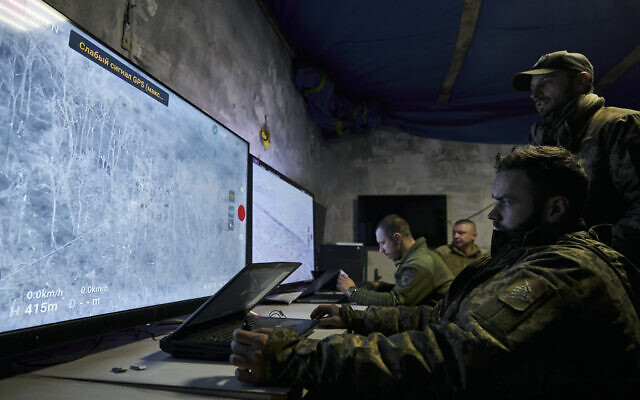 Ukrainian soldiers watch drone feeds from an underground command center in Bakhmut, Donetsk region, Ukraine, December 25, 2022. (AP Photo/Libkos) Ukrainian soldiers watch drone feeds from an underground command center in Bakhmut, Donetsk region, Ukraine, December 25, 2022. (AP Photo/Libkos)