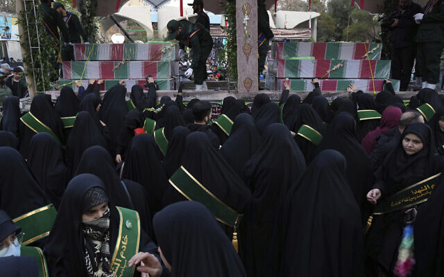 Mourners attend a funeral procession for a group of unknown Iranian soldiers killed during the 1980-88 Iran-Iraq war whose remains were recently recovered in the battlefields, in Tehran, Dec. 27, 2022. (AP Photo/Vahid Salemi) Mourners attend a funeral procession for a group of unknown Iranian soldiers killed during the 1980-88 Iran-Iraq war whose remains were recently recovered in the battlefields, in Tehran, Dec. 27, 2022. (AP Photo/Vahid Salemi)