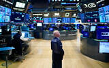 Traders work on the floor at the New York Stock Exchange in New York, December 29, 2022. (AP Photo/Seth Wenig)