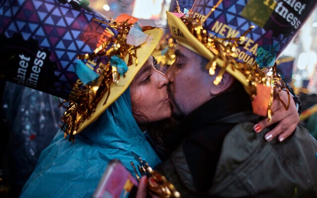 Revellers kiss during the New Year's Eve celebrations in Times Square on Jan. 1, 2023, in New York. (AP Photo/Andres Kudacki) Revellers kiss during the New Year's Eve celebrations in Times Square on Jan. 1, 2023, in New York. (AP Photo/Andres Kudacki)
