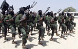 Hundreds of newly trained al-Shabaab fighters perform military exercises in the Lafofe area some 18 kilometers south of Mogadishu, Somalia. (AP Photo/Farah Abdi Warsameh)