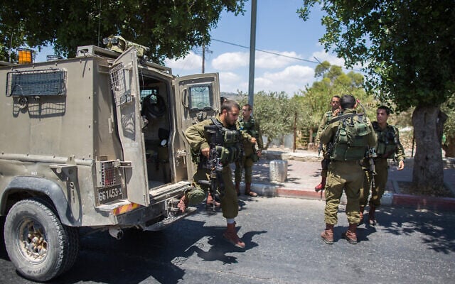 Illustrative: Israeli soldiers near the scene of a stabbing attack near a checkpoint between Jerusalem and the West Bank city of Bethlehem, June 29, 2015. (Yonatan Sindel/Flash90) Illustrative: Israeli soldiers near the scene of a stabbing attack near a checkpoint between Jerusalem and the West Bank city of Bethlehem, June 29, 2015. (Yonatan Sindel/Flash90)
