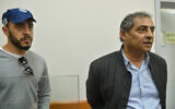 Arnon Giladi, right, then-deputy mayor of Tel Aviv arrives fora  remand hearing after being arrested in the corruption affair at the Rishon Lezion municipality at the Magistrate's Court in Rishon Letzion, February 4, 2017. (Flash90)