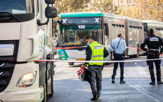 Illustrative: Police at the scene where a garbage truck hit and killed a woman outside the Jerusalem Central Bus Station on January 7, 2021. (Yonatan Sindel/Flash90) Illustrative: Police at the scene where a garbage truck hit and killed a woman outside the Jerusalem Central Bus Station on January 7, 2021. (Yonatan Sindel/Flash90)