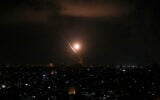 File: Rockets being fired by Islamic Jihad toward Israel from the Gaza Strip, on August 5, 2022. (Attia Muhammed/Flash90)