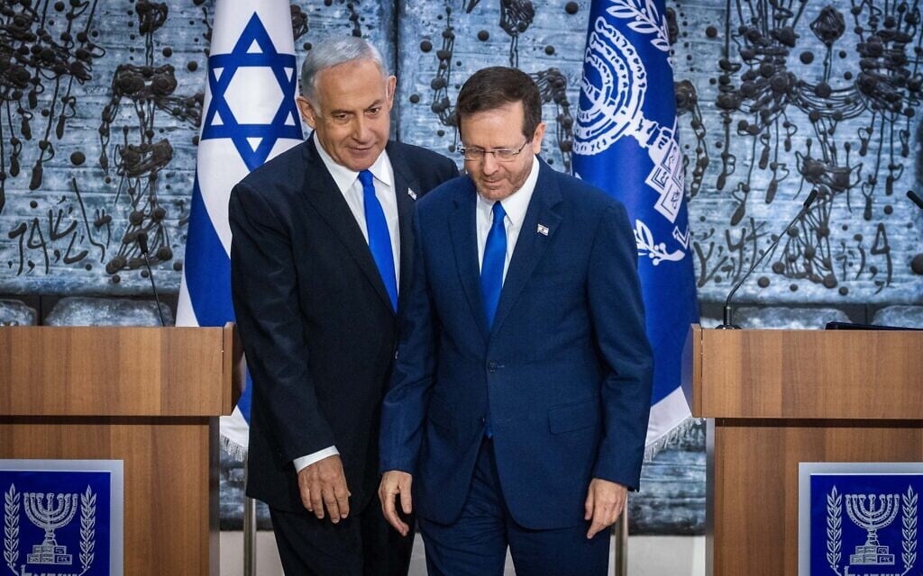 President Isaac Herzog, right, grants Likud party chairman MK Benjamin Netanyahu the mandate to form a new government, at the President's Residence in Jerusalem on November 13, 2022. (Olivier Fitoussi/ Flash90) President Isaac Herzog, right, grants Likud party chairman MK Benjamin Netanyahu the mandate to form a new government, at the President's Residence in Jerusalem on November 13, 2022. (Olivier Fitoussi/ Flash90)