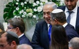 Likud leader Benjamin Netanyahu (center) and Otzma Yehudit leader Itamar Ben Gvir talk at the swearing-in ceremony of the 25th Knesset, November 15, 2022. (Olivier Fitoussi/ Flash90)