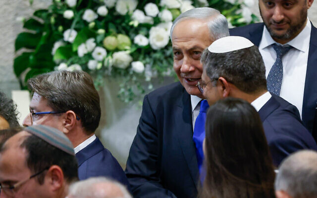 Likud leader Benjamin Netanyahu (center) and Otzma Yehudit leader Itamar Ben Gvir talk at the swearing-in ceremony of the 25th Knesset, November 15, 2022. (Olivier Fitoussi/ Flash90) Likud leader Benjamin Netanyahu (center) and Otzma Yehudit leader Itamar Ben Gvir talk at the swearing-in ceremony of the 25th Knesset, November 15, 2022. (Olivier Fitoussi/ Flash90)