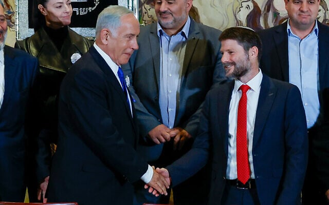 Likud leader Benjamin Netanyahu and Religious Zionist party head Bezalel Smotrich and other party leaders in a group photo after the swearing-in of the 25th Knesset, November 15, 2022. (Olivier Fitoussi/Flash90) Likud leader Benjamin Netanyahu and Religious Zionist party head Bezalel Smotrich and other party leaders in a group photo after the swearing-in of the 25th Knesset, November 15, 2022. (Olivier Fitoussi/Flash90)