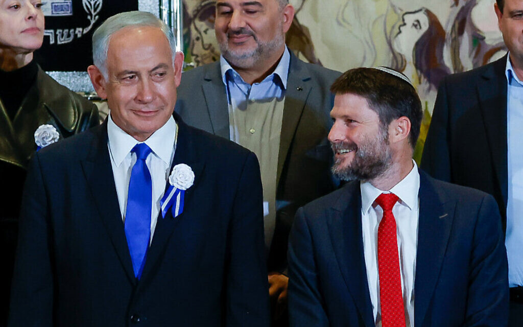 Likud leader Benjamin Netanyahu, left, Religious Zionism party head Bezalel Smotrich and other party leaders in a group photo after the swearing-in of the 25th Knesset, November 15, 2022. (Olivier Fitoussi/Flash90) Likud leader Benjamin Netanyahu, left, Religious Zionism party head Bezalel Smotrich and other party leaders in a group photo after the swearing-in of the 25th Knesset, November 15, 2022. (Olivier Fitoussi/Flash90)