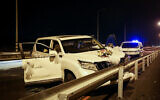 Police at the scene where a man was shot and seriously injured while driving in a motorcade that was making its way to a wedding, near Omer, in southern Israel, on December 2, 2022 (Flash90)