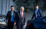 Presumed incoming prime minister Benjamin Netanyahu, seen after coalition talks with Shas chairman MK Aryeh Deri and Religious Zionist party head MK Bezalel Smotrich, outside a hotel in Jerusalem, December 5, 2022. (Yonatan Sindel/Flash90)
