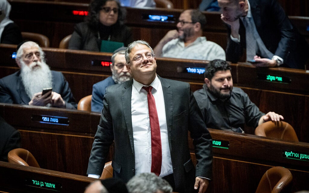 Head of the Otzma Yehudit party MK Itamar Ben Gvir with other MK's after a vote in the Knesset in Jerusalem, on December 20, 2022. (Yonatan Sindel/Flash90)