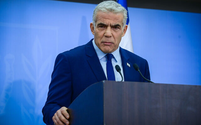 Prime Minister Yair Lapid holds a press conference in Tel Aviv on December 22, 2022. (Tomer Neuberg/Flash90)