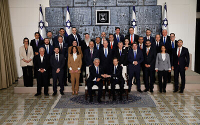 Members of the new government headed by Prime Minister Benjamin Netanyahu pose for a group photo at the President's Residence in Jerusalem, on December 29, 2022. (Yonatan Sindel/Flash90)