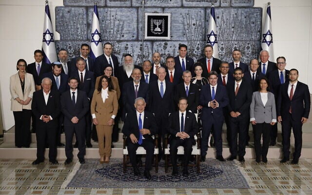 Members of the new Israeli government, headed by Prime Minister Benjamin Netanyahu, pose for a group photo at the president's residence in Jerusalem, on December 29, 2022. (Yonatan Sindel/Flash90) Members of the new Israeli government, headed by Prime Minister Benjamin Netanyahu, pose for a group photo at the president's residence in Jerusalem, on December 29, 2022. (Yonatan Sindel/Flash90)
