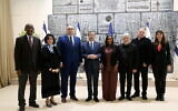 From left: Dr. Sefefe Aitchek, Dr. Irene-Rina Fremont, Leonardo Oros Duek, President Isaac Herzog, Minister Pnina Tamano-Shata, prize committee head Yossi Alfi, Vladimir Cohen and Kira Radinsky pose for a photograph at the President's Residence in Jerusalem on December 1, 2022. (Amos Ben Gershom/GPO)