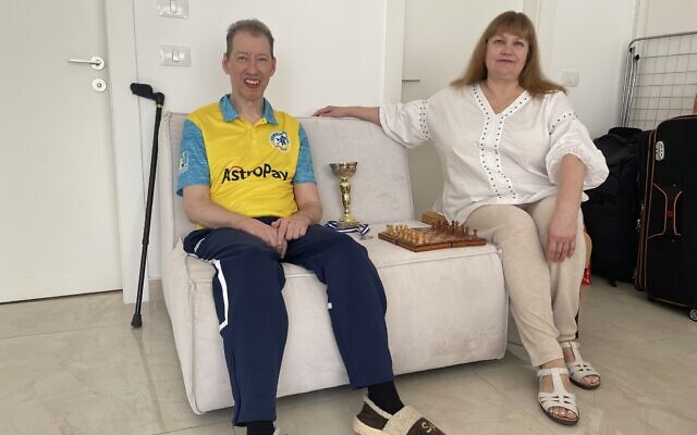 Igor Yarmonov and Galina Gurina in their room in a communal flat in Ashdod, December 18, 2022. (Inna Lazareva/Times of Israel)