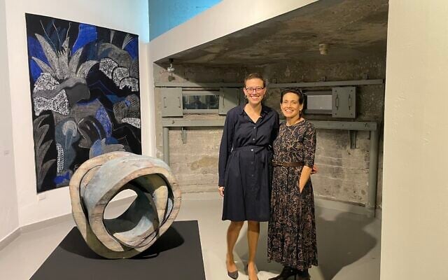 Artists Sarah Benninga (left) and Rachel Rotenberg at the December 28, 2022 Museum on the Seam reopening of 'Kravot,' their exhibit that includes nude imagery and was previously shuttered. (Jessica Steinberg/Times of Israel)