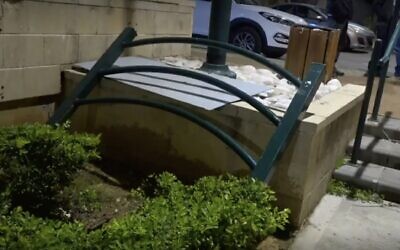 A piece of metal fencing that fell on a 3-year-old girl and fatally injured her is seen in the central town of Ness Ziona, December 8, 2022. (Ynet screen capture, used in accordance with Clause 27a of the Copyright Law)