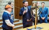 Houston Astros third baseman Alex Bregman leads Congregation Beth Yeshurun in the Hanukkah blessing on December 21, 2022. (Daniel Bissonnet/Houston Jewish Herald-Voice)