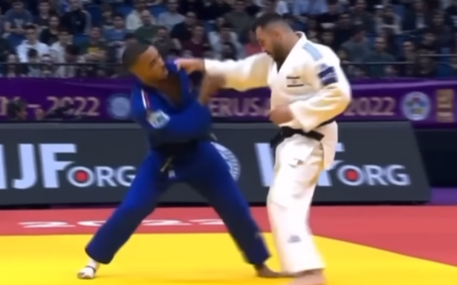 Israeli judoka Baruch Shmailov (right) during his match against French judoka Daikii Bouba at the Jodu Masters tournament in Jerusalem, December 20, 2022. (YouTube screenshot: used in accordance with Clause 27a of the Copyright Law) Israeli judoka Baruch Shmailov (right) during his match against French judoka Daikii Bouba at the Jodu Masters tournament in Jerusalem, December 20, 2022. (YouTube screenshot: used in accordance with Clause 27a of the Copyright Law)