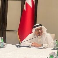 Bahrain’s Foreign Minister, Abdul Lateef Rashid Al Zayani, speaks to journalists in Manama on December 4, 2022. (Lazar Berman/Times of Israel)