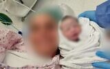 A photo of the mother, who was rushed to Shaare Zedek Medical Center after a stroke, with her healthy baby girl. The photo has been blurred at the woman's request. (courtesy of Shaare Zedek Medical Center)