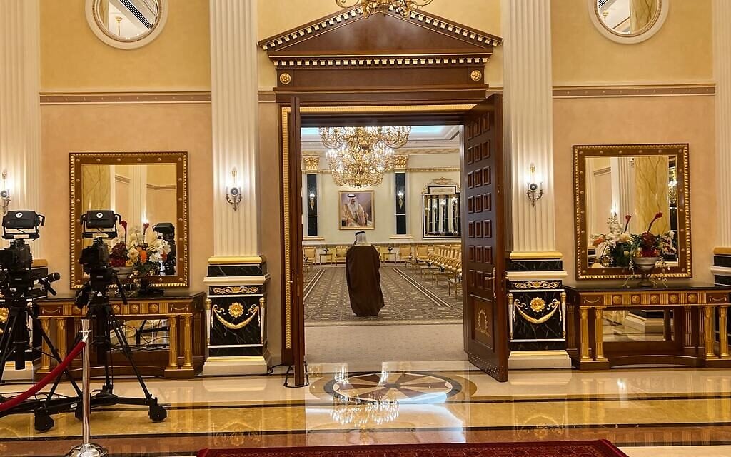 A Bahraini official walks through the Al-Qudaibiya palace in Manama during President Isaac Herzog's visit, December 4, 2022 (Lazar Berman/Times of Israel) A Bahraini official walks through the Al-Qudaibiya palace in Manama during President Isaac Herzog's visit, December 4, 2022 (Lazar Berman/Times of Israel)
