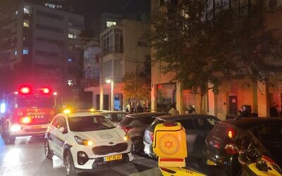 Medics, police and fire services are seen at the scene of a fire in Givatayim, near Tel Aviv, December 10, 2022. (Magen David Adom)