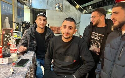 Young French Jews of Moroccan descent in Jerusalem watch France battle Morocco in the World Cup Semifinal, December 15, 2022 (Lazar Berman/The Times of Israel)