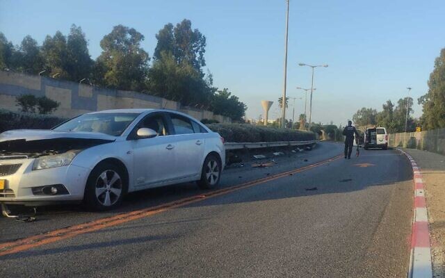 Police investigate the site of a collision between a motorcycle and a car in the northern city of Haifa, December 16, 2022. (Israel Police) Police investigate the site of a collision between a motorcycle and a car in the northern city of Haifa, December 16, 2022. (Israel Police)