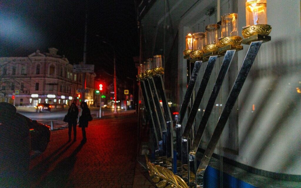 A menorah burns in Kharkiv, Ukraine, on the first night of Hanukkah, December 18, 2022 (courtesy Kharkiv Choral Synagogue)
