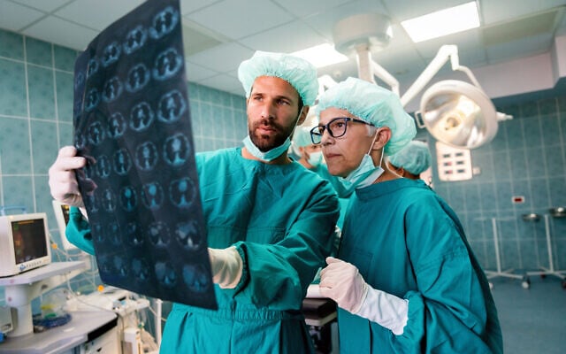 Illustrative image: Doctors reading an x-ray for signs of cancer (nd3000 via iStock by Getty Images) Illustrative image: Doctors reading an x-ray for signs of cancer (nd3000 via iStock by Getty Images)