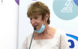 Myrna Bennett speaks after receiving a 3rd COVID-19 vaccine, at a Maccabi Healthcare Services clinic in Haifa, August 3, 2021. (Omer Miron/GPO)