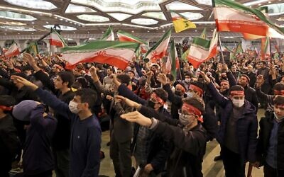 Iranians react during a commemoration ceremony in the capital Tehran on January 3, 2023 marking the third anniversary of the US killing of top Iranian Revolutionary Guards commander Qasem Soleimani and Iraqi commander Abu Mahdi al-Muhandis. (ATTA KENARE / AFP)