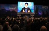 Supporters of Hezbollah attend a televised speech by the group's leader Hassan Nasrallah in the Lebanese capital Beirut on January 3, 2023. (Anwar Amro/AFP)
