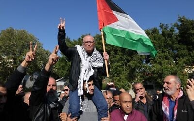 Arab Israeli Karim Younis is carried by friends and relatives following his release after 40 years in an Israeli prison for kidnapping and murdering an Israeli soldier, on January 5, 2023, in the northern Israeli town of 'Ara. (AHMAD GHARABLI / AFP)