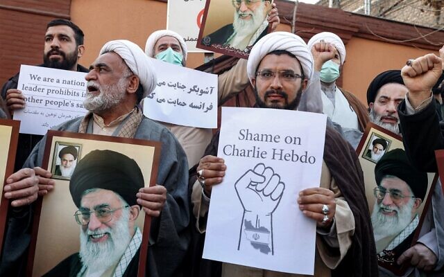 Demonstrators gather with images of Iran's supreme leader Ayatollah Ali Khamenei during a protest against defamatory cartoons depicting him published by French satirical weekly Charlie Hebdo, outside the French embassy in Iran's capital Tehran on January 8, 2023. (ATTA KENARE / AFP) Demonstrators gather with images of Iran's supreme leader Ayatollah Ali Khamenei during a protest against defamatory cartoons depicting him published by French satirical weekly Charlie Hebdo, outside the French embassy in Iran's capital Tehran on January 8, 2023. (ATTA KENARE / AFP)