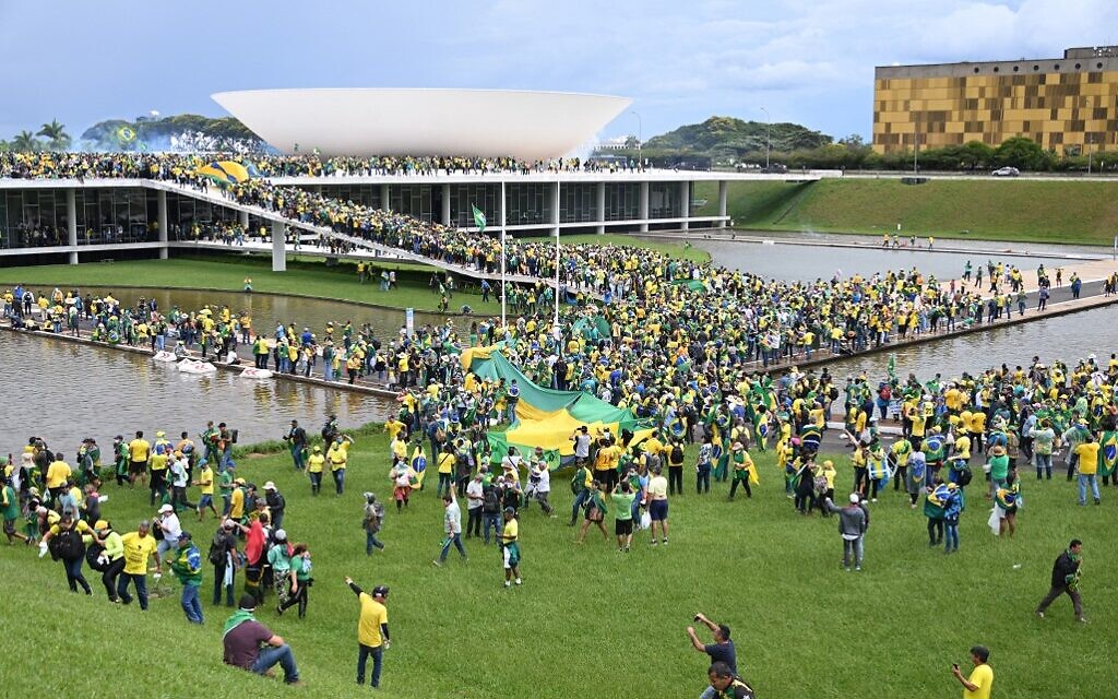 Supporters of Brazilian former president Jair Bolsonaro hold a demonstration at the Esplanada dos Ministerios in Brasilia on January 8, 2023. (Photo by EVARISTO SA / AFP)