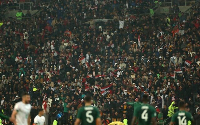 Supporters cheer from the stands during the Arabian Gulf Cup football match between Iraq and Saudi Arabia at the Basra International Stadium in Basra, Iraq, on January 9, 2023. (Hussein Faleh / AFP) Supporters cheer from the stands during the Arabian Gulf Cup football match between Iraq and Saudi Arabia at the Basra International Stadium in Basra, Iraq, on January 9, 2023. (Hussein Faleh / AFP)