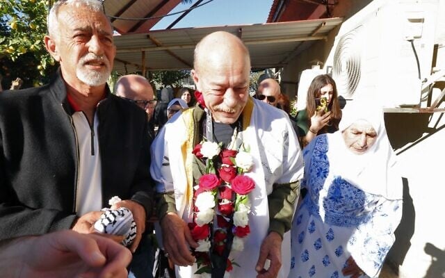 Arab Israeli Maher Younis is welcomed by friends and relatives following his release after 40 years in an Israeli prison for kidnapping and murdering an Israeli soldier, in the northern Israeli town of 'Ara, on January 19, 2023. (Photo by AHMAD GHARABLI / AFP) Arab Israeli Maher Younis is welcomed by friends and relatives following his release after 40 years in an Israeli prison for kidnapping and murdering an Israeli soldier, in the northern Israeli town of 'Ara, on January 19, 2023. (Photo by AHMAD GHARABLI / AFP)