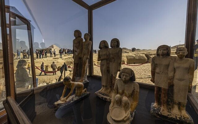 A collection of pharaoh statues is on display during a press conference at the Saqqara necropolis, where a gold-laced mummy and four tombs including of an ancient king's 'secret keeper' were discovered, south of Cairo on January 26, 2023. (Khaled DESOUKI / AFP)